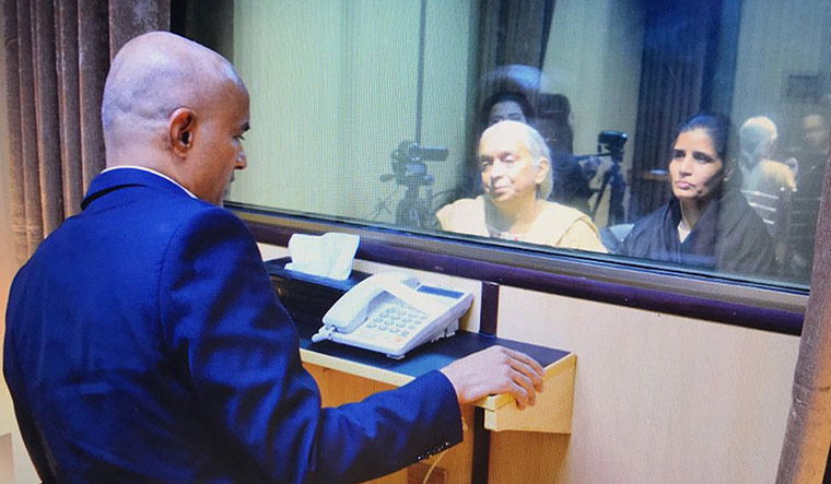 Glimmer of hope: Jadhav, who is imprisoned in Pakistan, meeting his mother and wife at the foreign office in Islamabad | AP