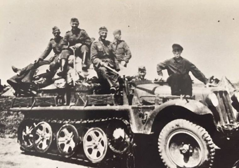The nazi self: Perel (right) with his nazi colleagues on a military vehicle.