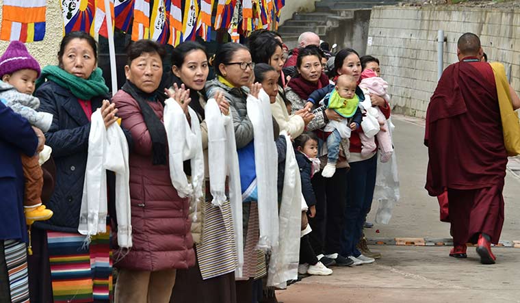 High spirits: Devotees outside the venue of the Tibetan Buddhist religious conference | Aayush Goel