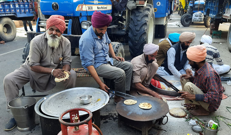 Bread and butter issue: Farmers have made makeshift kitchens at protest sites, and are being helped by volunteer organisations | Aayush Goel