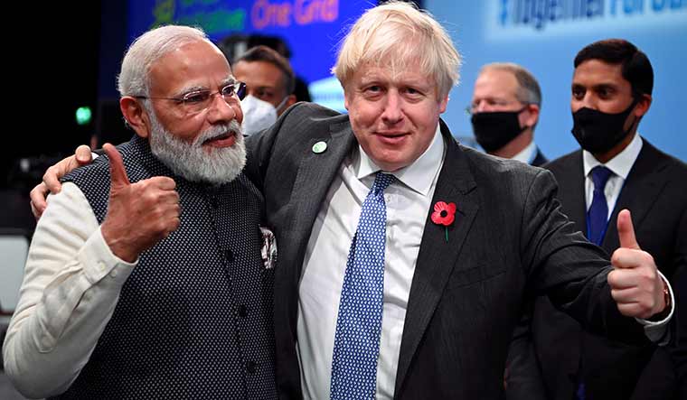 [File] Prime Minister Narendra Modi with British Premier Boris Johnson | Reuters
