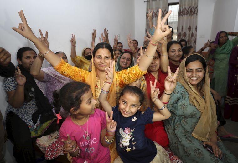 Joy of freedom: Family members and relatives of Rakeshwar Singh Manhas celebrate after hearing the news of his release at their residence in Jammu | PTI