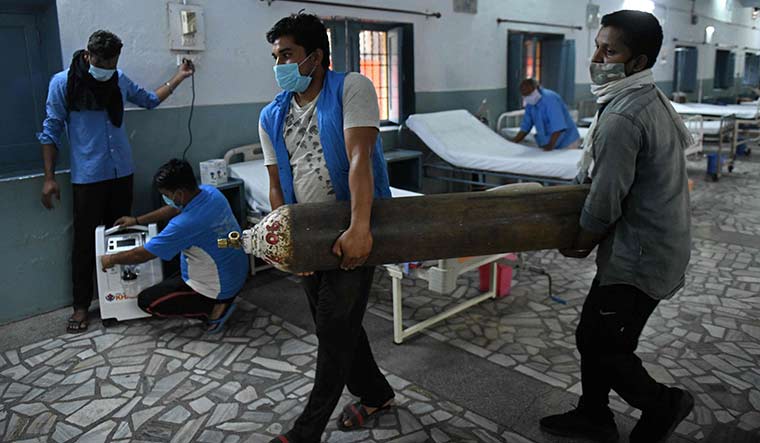 Battle ready: Employees of a charitable society make oxygen arrangements at a Covid facility in Amritsar | AFP