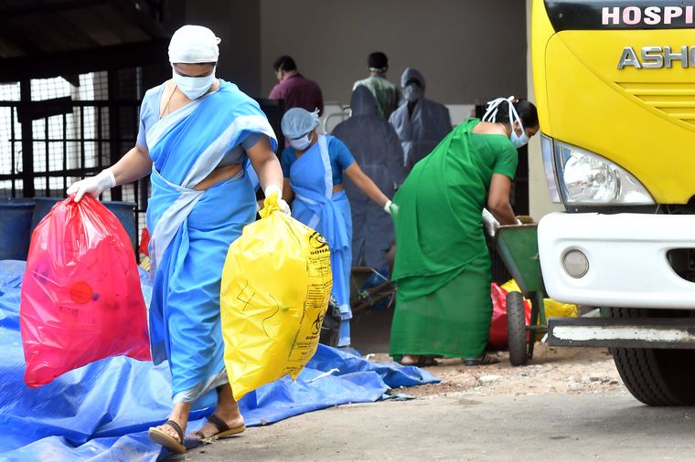 Handling without care: Cleaning staff of the Kozhikode Medical College Hospital in Kerala, where an  observation ward was opened after a Nipah outbreak in May 2018 | Russell Shahul