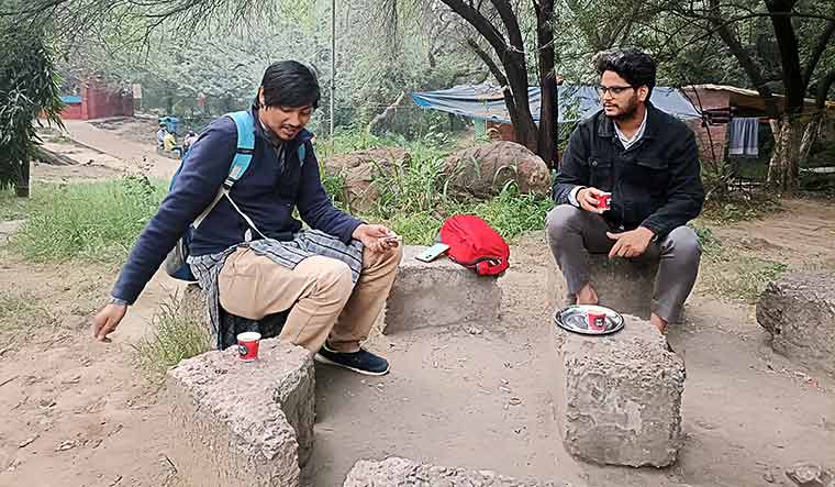 Course correction: PhD scholar Shivam Mogha (right) with a friend on the JNU campus | Ashutosh