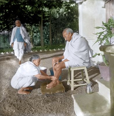 Selfless soul: Kasturba washing Gandhi’s feet at Surat on January 23, 1939 | Dinodia
