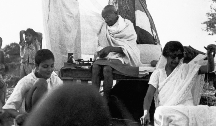 Spinning a movement: Rajkumari Amrit Kaur (right) with Mahatma Gandhi at Sevagram Ashram  | DINODIA