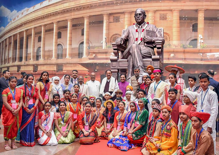 Unity in diversity: Naidu with students who welcomed him in 22 Indian languages on International Mother Language Day in February 2020 | PTI