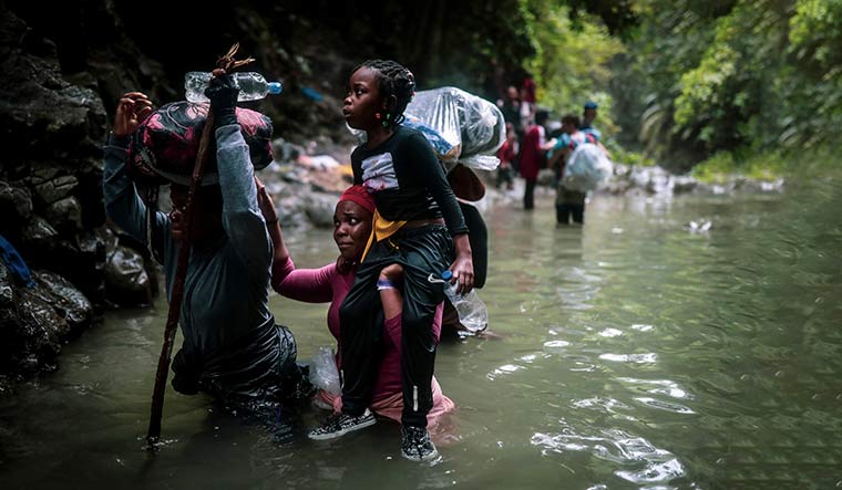 Obstacle  course: Migrants from Haiti making their way through a section of the Darién Gap | AP