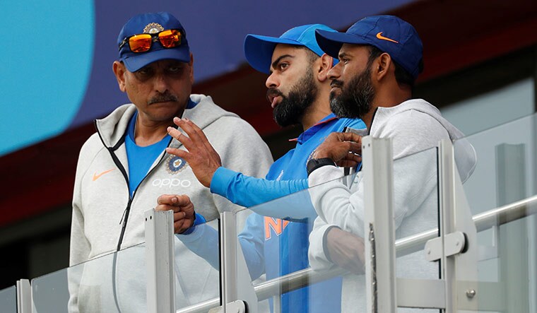 War council: India captain Virat Kohli with head coach Ravi Shastri and fielding coach R. Sridhar | Reuters
