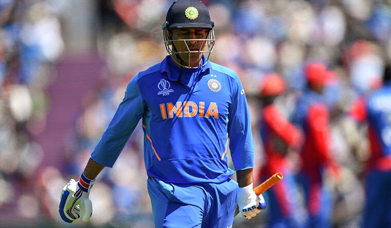 Finishing trouble: M.S. Dhoni walks back to the pavilion after his dismissal against Afghanistan | AFP