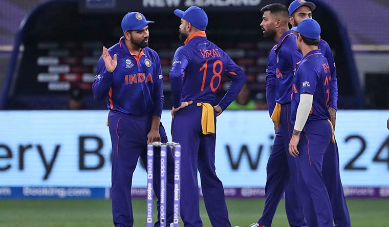 Strategic timeout: Sharma (left) talks tactics with Kohli during India’s match against New Zealand in the ongoing T20 World Cup | AP