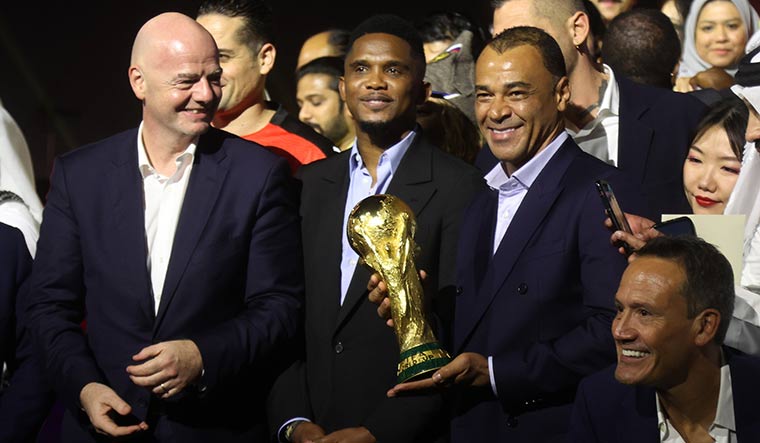 Star-studded countdown: (From left) Gianni Infantino, former Cameroon striker Samuel Eto’o and former Brazil defender Cafu pose with the World Cup in Qatar in November | Reuters