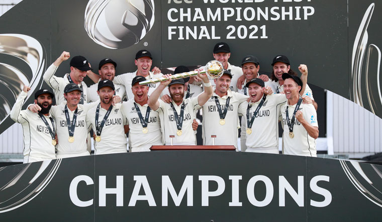 Chokers no more: Kane Williamson holds aloft the ICC Test mace as the team celebrates the WTC final victory over India | PTI