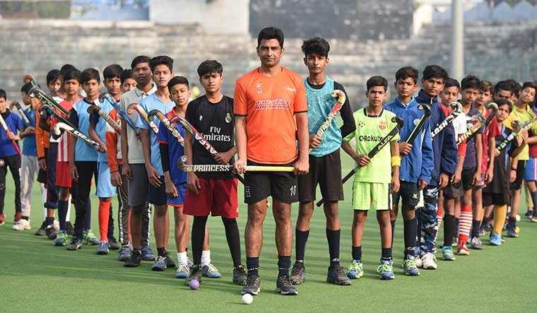 Forging the future: Olympian hockey player Sameer Dad with his trainees at Aishbagh Stadium, Bhopal | Mujeeb Faruqui