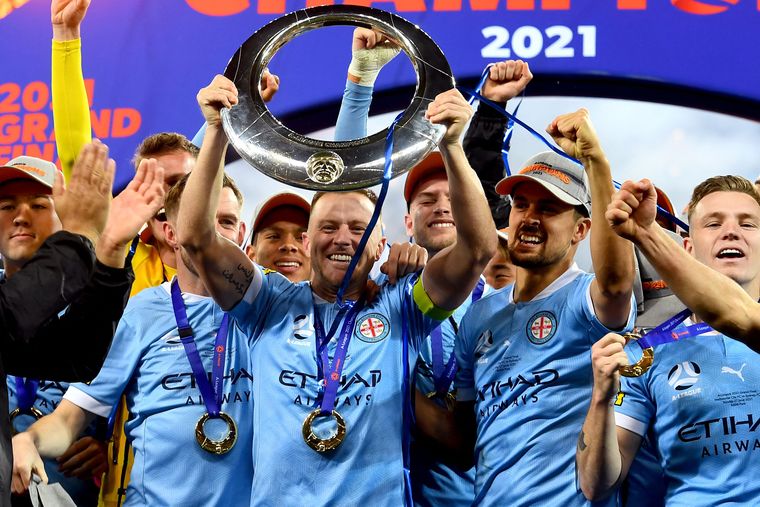 Melbourne City players celebrate after winning the A-League Grand Final in June | AFP