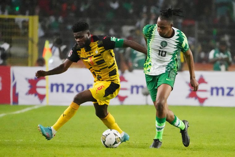 National hero: Ghana's Thomas Partey (left) in action against Nigeria on March 29 in the African qualifiers. His goal on the day eliminated Nigeria and secured Ghana's spot | AP