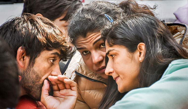 Bout time: (From left) Bajrang Punia, Sakshi Malik and Sangita Phogat at Jantar Mantar | PTI
