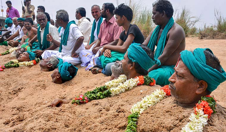 Neck-deep in misery: Farmers in the Cauvery riverbed at Tiruchirapalli protest the delay in setting up the Cauvery Management Board | PTI