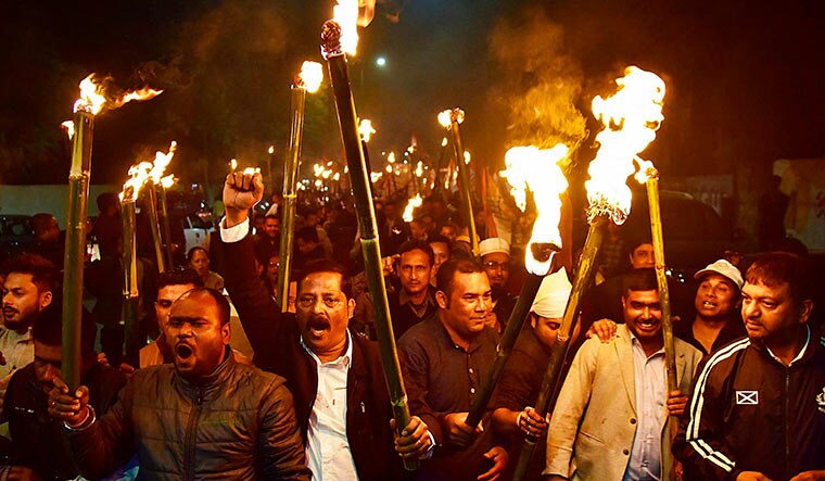 Burning anger: Congress workers in Guwahati taking out a torch light procession against the Citizenship Bill | PTI