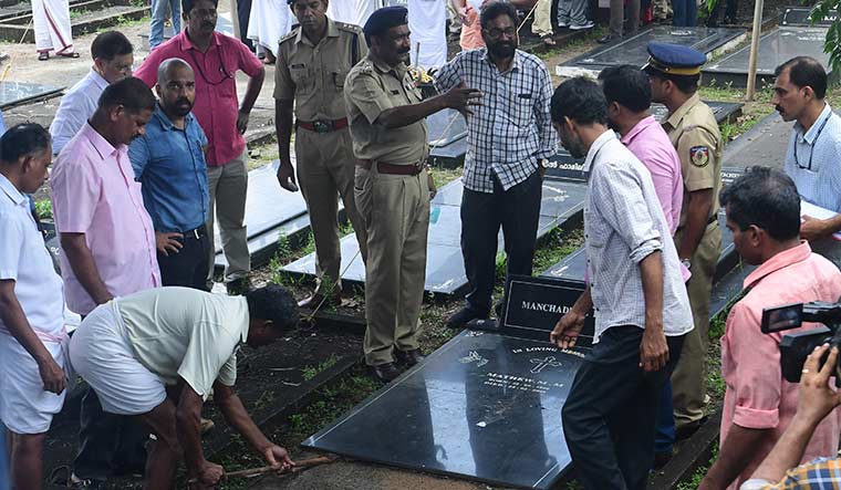 Unearthing truth: Forensic experts open the grave at Lourdes Matha Church, Koodathai, as part of the investigation | M.T. Vidhuraj