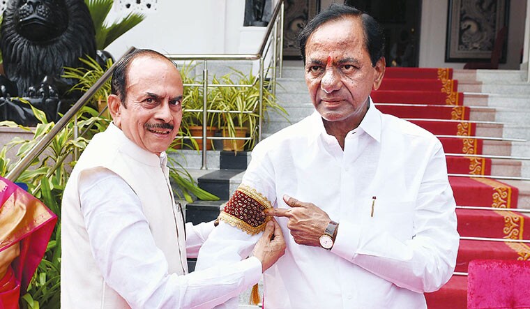 Lean cabinet: Telangana Chief Minister K. Chandrashekar Rao (right) and Home Minister Mahmood Ali during their swearing in.