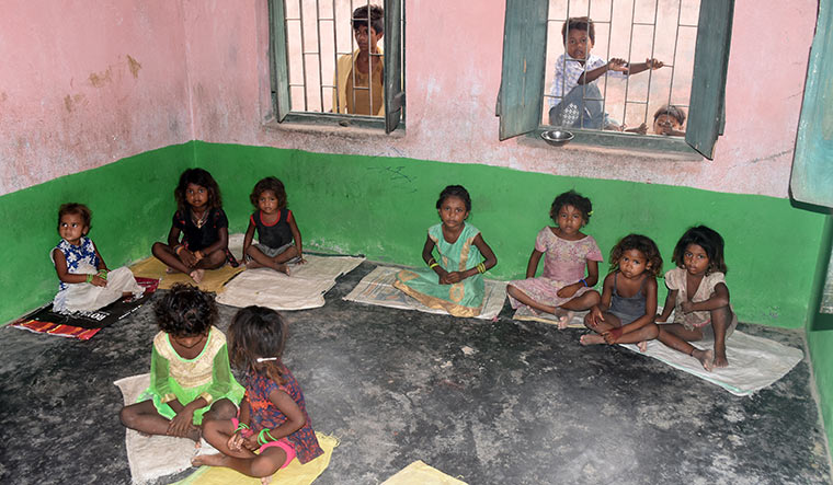 Here for a morsel: Children wait for food at anganwadi number 91 at Harivanshpur village | Deepak Kumar