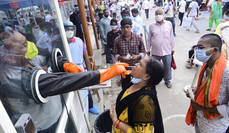 Test point: People queue up for a Covid 19 test outside a hospital counter in Lucknow | Pawan Kumar