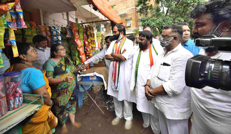 State Congress working president Uttam Kumar Reddy (arms crossed) with candidate Srinivas Reddy | P. Anil Kumar