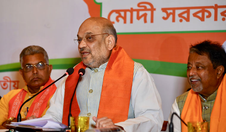 [File] Amit Shah with Dilip Ghosh (left) and Mukul Roy (right) |  Salil Bera