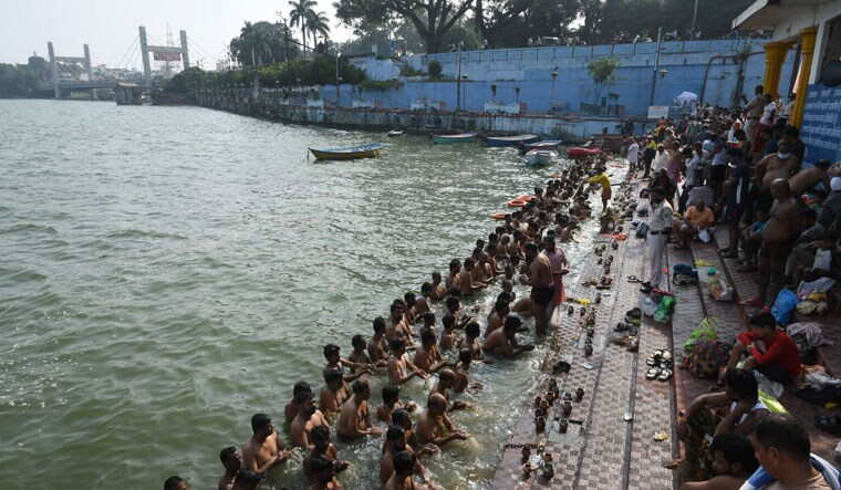 Faith bank: people take a dip in the upper lake for a religious ritual | Mujeeb Faruqui