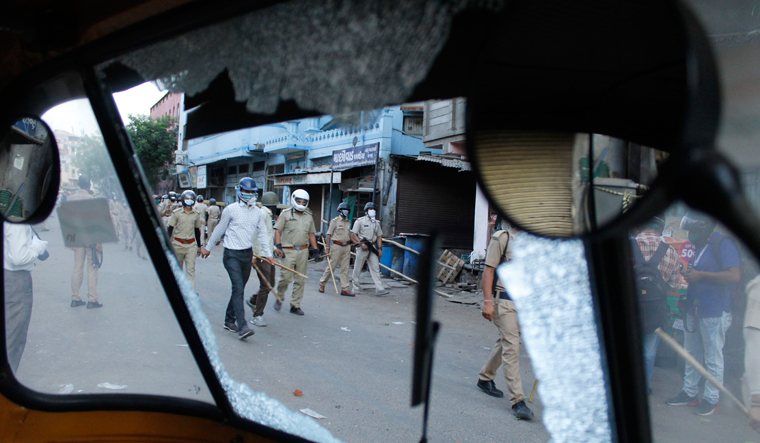 Rocky road: In early May, some residents of Shahpur area of Ahmedabad pelted stones at the police who were enforcing the lockdown | Janak Patel