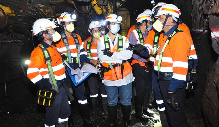 Deep insights: Kotru (fourth from left) with miners; women were allowed to work in underground mines in 2019.