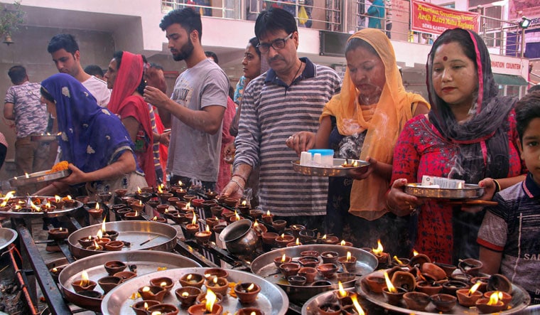 Lighting hope: A file picture of Kashmiri Pandits offering prayers at the replica of Kheer Bhawani temple during the Kheer Bhawani Mela in Jammu | PTI