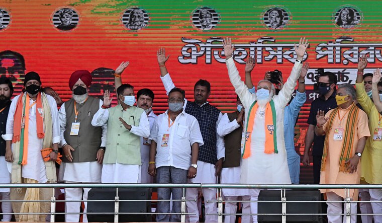 Saffron charge: Prime Minister Modi with BJP leaders, including Mithun Chakraborty (far left), at Birgade Parade Ground in Kolkata | Salil Bera