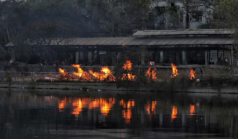 Reign of death: Pyres burn continuously at the Baikunth Dham in Lucknow as the city faces an alarmingly growing number of Covid-19 deaths | Pawan Kumar