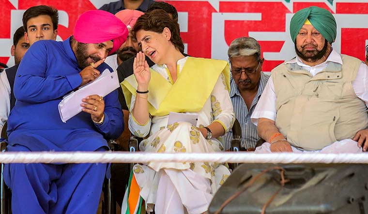 Captain and the player: Priyanka Gandhi Vadra with Navjot Singh Sidhu and Amarinder Singh at an election rally in 2019 | PTI