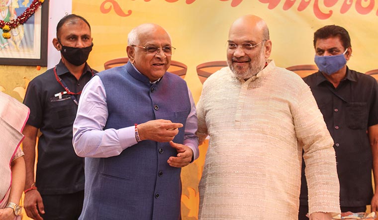 Homecoming: Union Home Minister Amit Shah with Bhupendra Patel | PTI