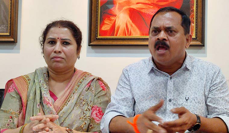 Making a point: Former Navi Mumbai corporator M.K. Madhavi with wife Vinaya during the news conference where he alleged that he was threatened by Maharashtra Chief Minister Eknath Shinde and Deputy Commissioner of Police Vivek Pansare.