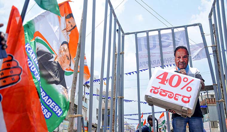 Seizing the moment: Congress workers in Chikmagalur during a protest against K.S. Eshwarappa | PTI