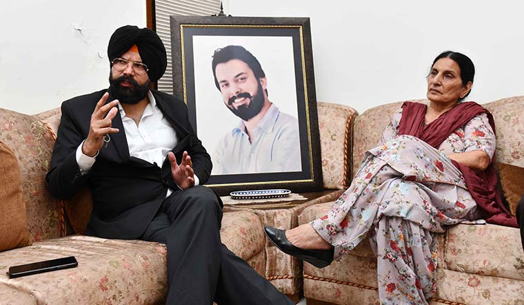 Fight for justice: Sippy Sidhu’s brother Jippy and mother Deepender Kaur with his photo at their house in Chandigarh | Sanjay Ahlawat