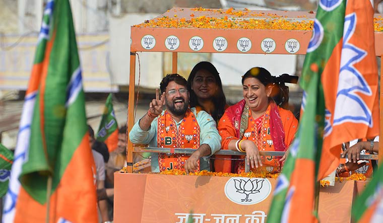 Campaign cheer: Upen Yadav with Union Minister Smriti Irani at a road show in Shahpura | Sanjay Ahlawat