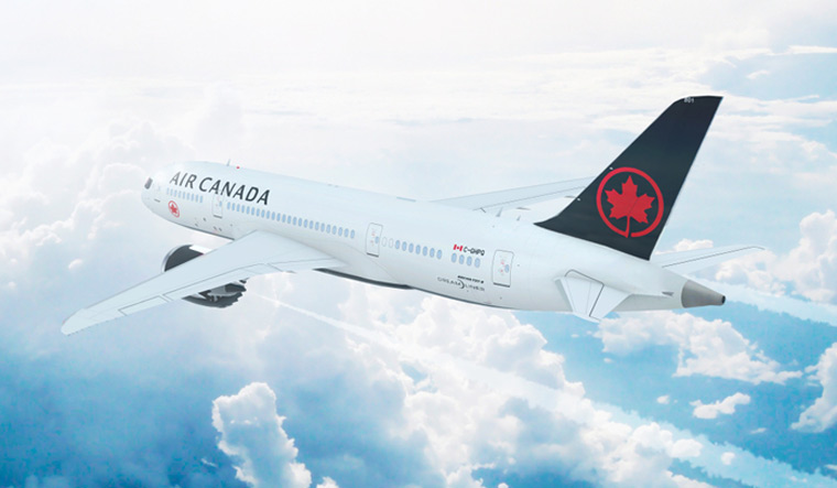 Air-Canada-Boeing-787-Dreamliner-flying-high-above--clouds-shut
