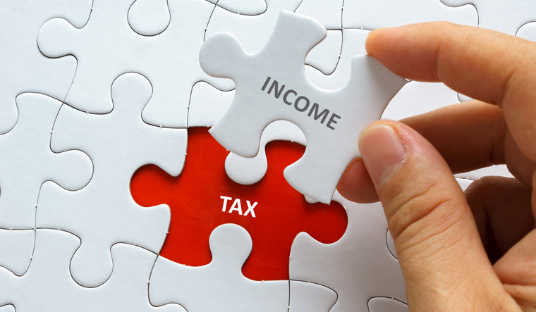 Income-tax-jigsaw-puzzle-income-tax-taxation-shut