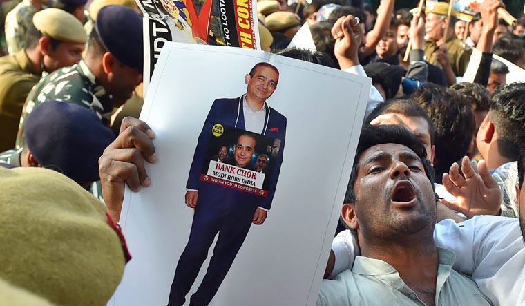 Youth Congress activists raise slogans as they protest against Nirav Modi in the Punjab National Bank fraud case in New Delhi | PTI