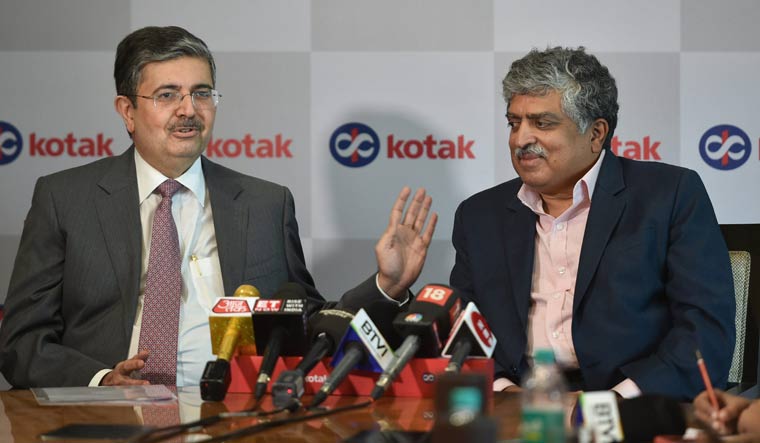 Managing Director of Kotak Mahindra Bank Uday Kotak speaks as Infosys Co-Founder and Non-Executive Chairperson Nandan Nilekani looks on, during a press conference in Mumbai | PTI