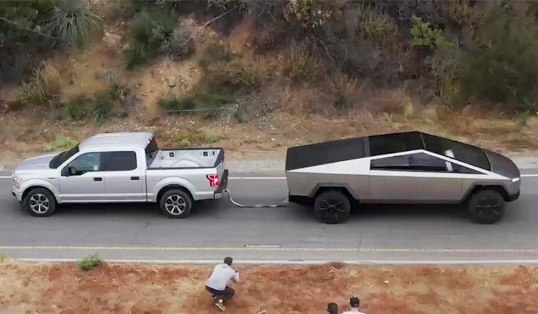 A Ford F-150 in a towing battle with the Tesla Cybertruck | Elon Musk's Twitter