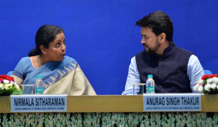 Finance Minister Nirmala Sitharaman and MoS for Finance Anurag Thakur at a function in New Delhi | PTI