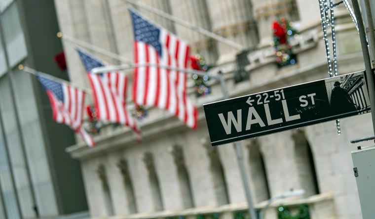 The Wall St. street sign outside the New York Stock Exchange | AP