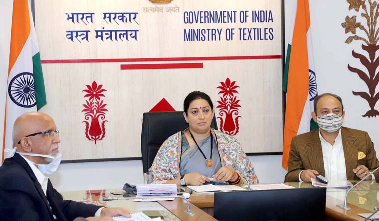 Union Minister for Women & Child Development and Textiles, Smriti Irani, addresses at a Webinar on 'A Movement Towards Atmanirbhar Bharat-Competitiveness and Manufacturing of PPEs', organised by the Institue for Competitiveness (IFC), in New Delhi | PTI